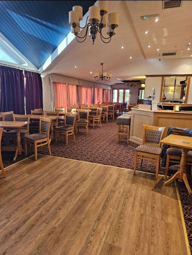 Porters Lounge, with tables, chairs and the bar
